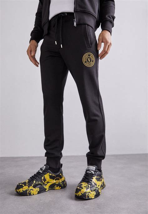 versace tracksuit black and gold